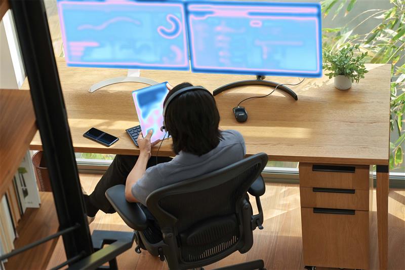 Microsoft unveils Microsoft Security Copilot agents and new protections for AI 2 a person sitting at a desk with a computer